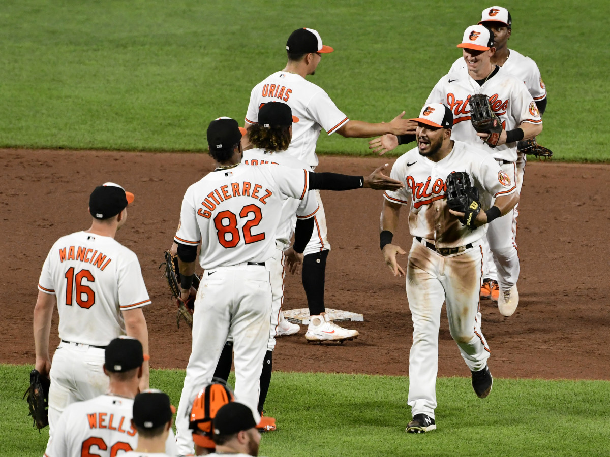 Aug 25, 2021; Baltimore, Maryland, USA; Baltimore Orioles right fielder Anthony Santander (25) celebrates with teammates after beating against the Los Angeles Angels ending their 19 game loosing streak. at Oriole Park at Camden Yards.